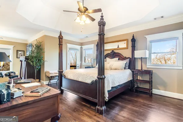 a view of a room with furniture and wooden floor
