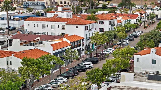 an aerial view of multiple houses with yard