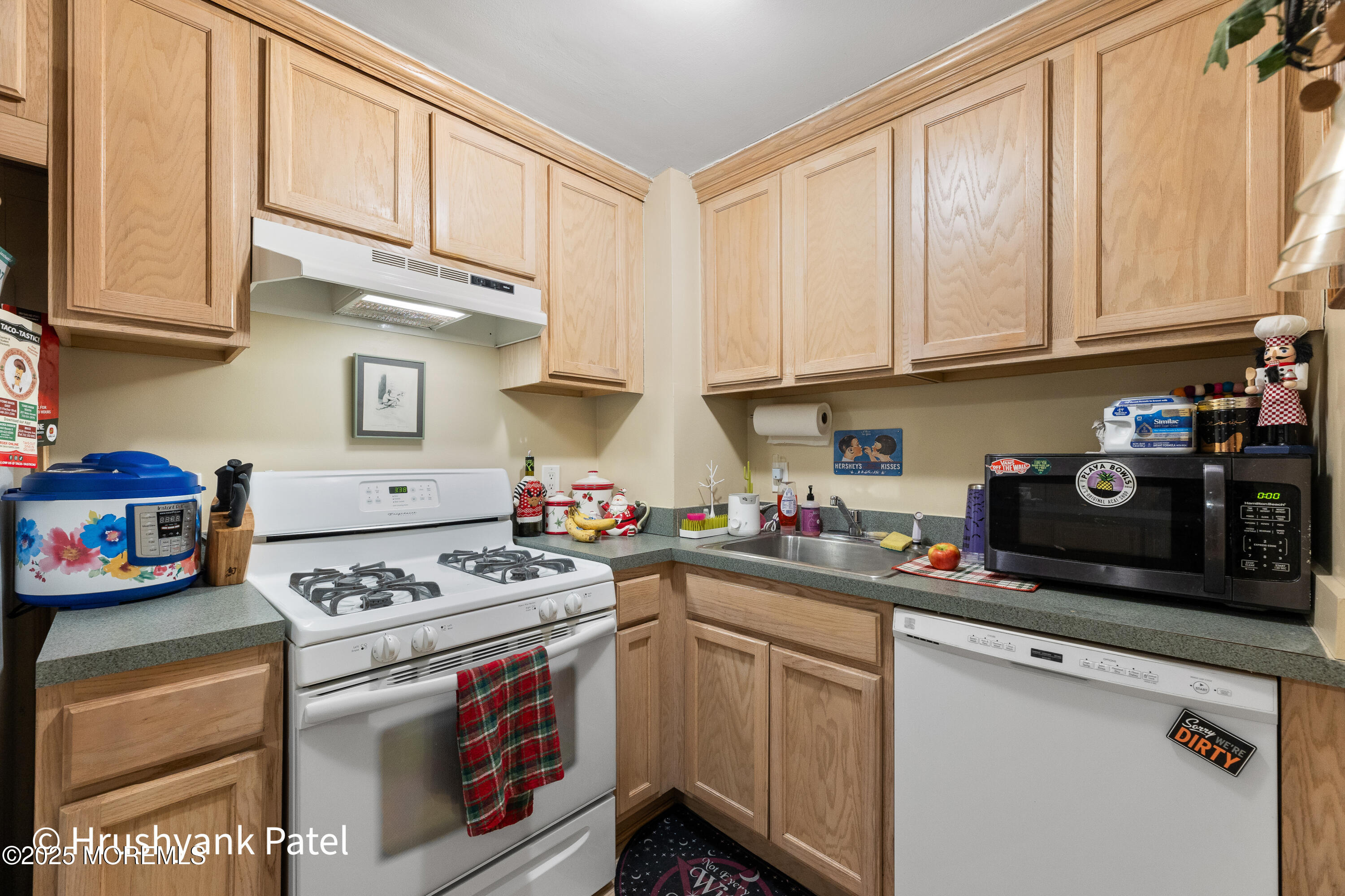 Mantoloking Road Brick, NJ 08723 - Photo 14 of 24 a kitchen with stainless steel appliances granite countertop a stove a sink dishwasher and cabinets with wooden floor