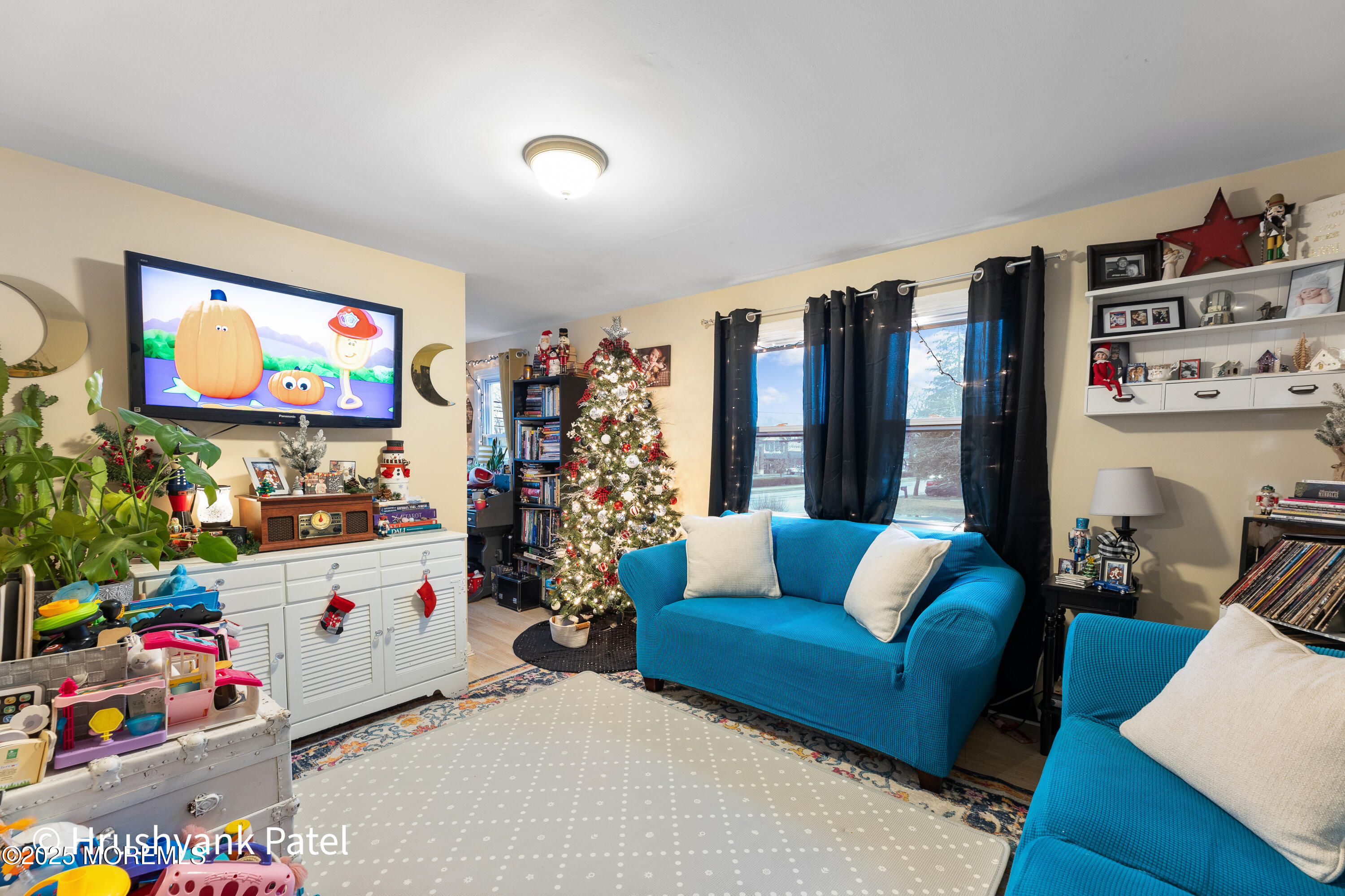 Mantoloking Road Brick, NJ 08723 - Photo 20 of 24 a living room with furniture and a flat screen tv