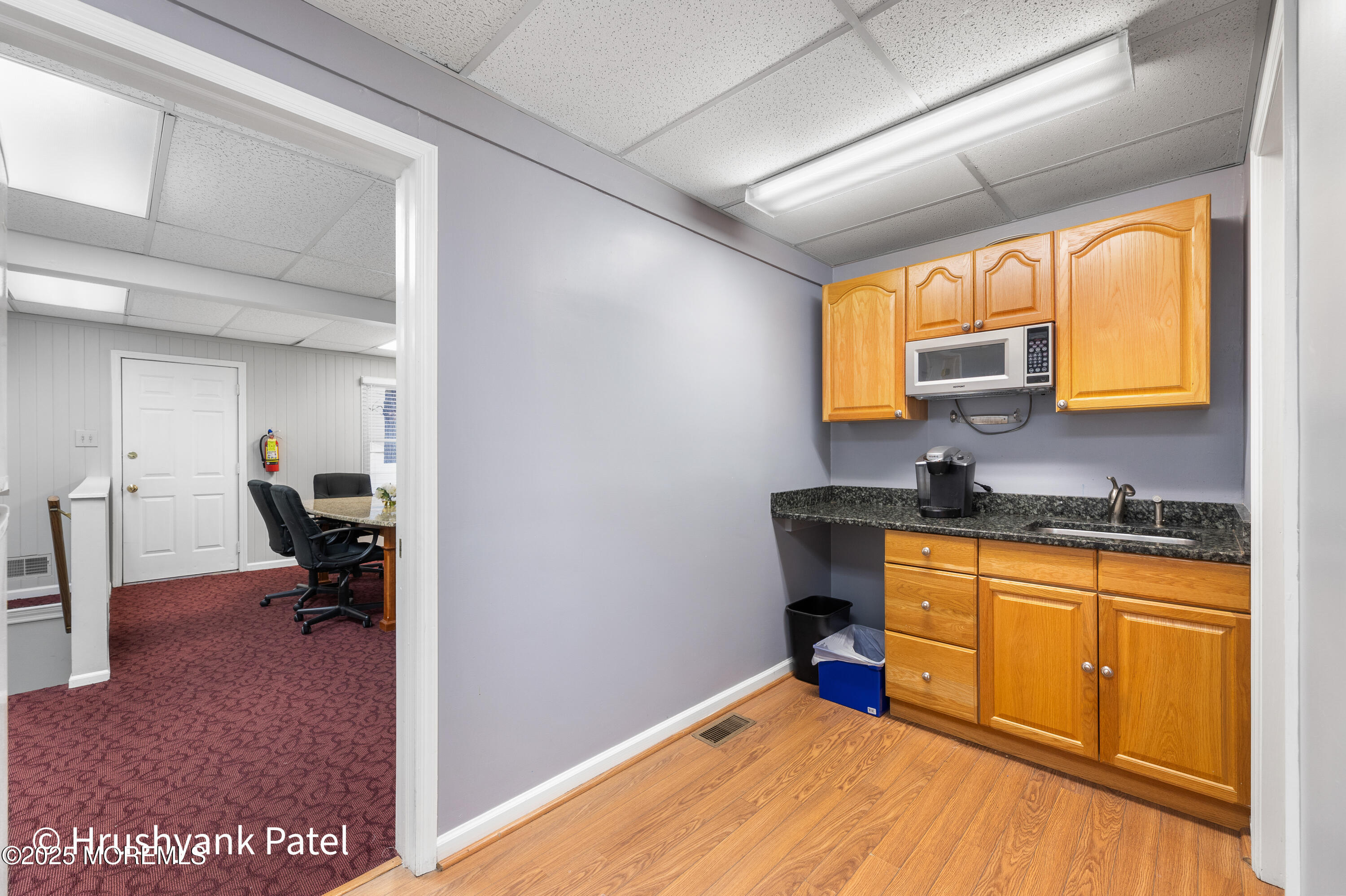 Mantoloking Road Brick, NJ 08723 - Photo 9 of 24 a kitchen with granite countertop a stove a sink and a window