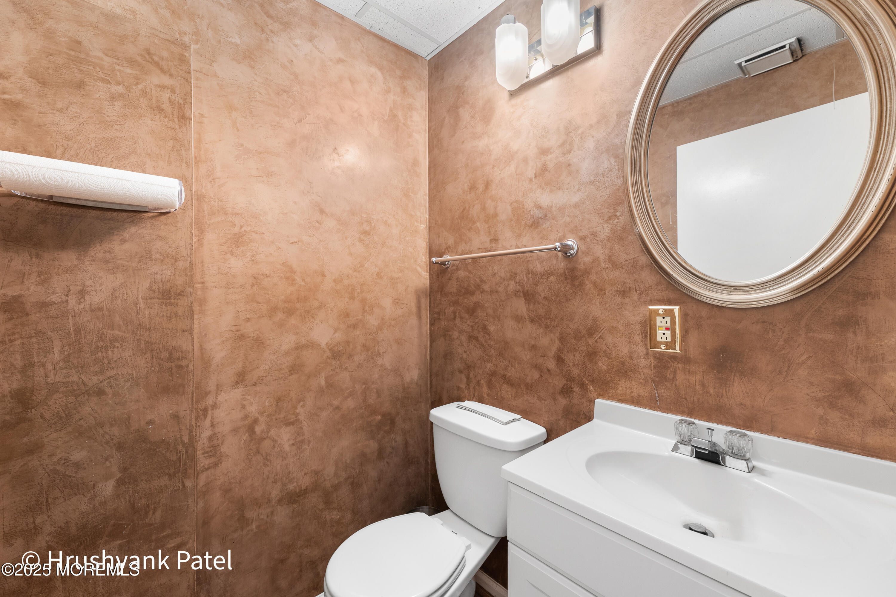 Mantoloking Road Brick, NJ 08723 - Photo 10 of 24 a bathroom with a toilet and a sink