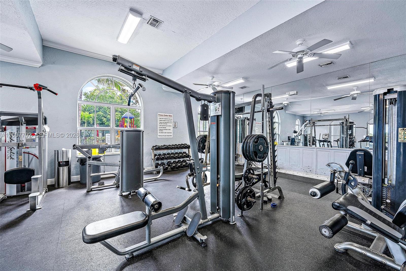 3229 Laurel Ridge Circle, Unit 3229 Riviera Beach, FL 33404 - Photo 20 of 24 a view of a room with gym equipment