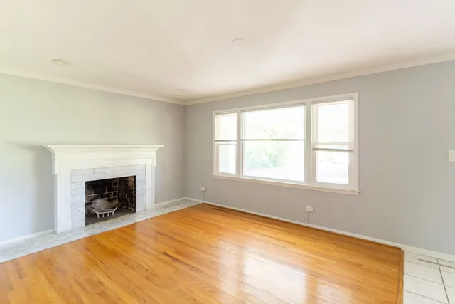 a kitchen with a refrigerator a sink dishwasher with a dining table and chairs
