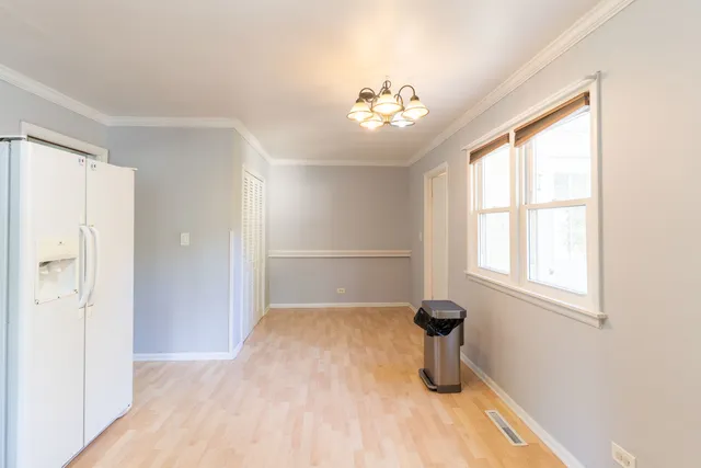 a bedroom with bed and window