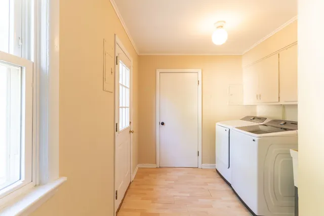 an empty room with fan and windows