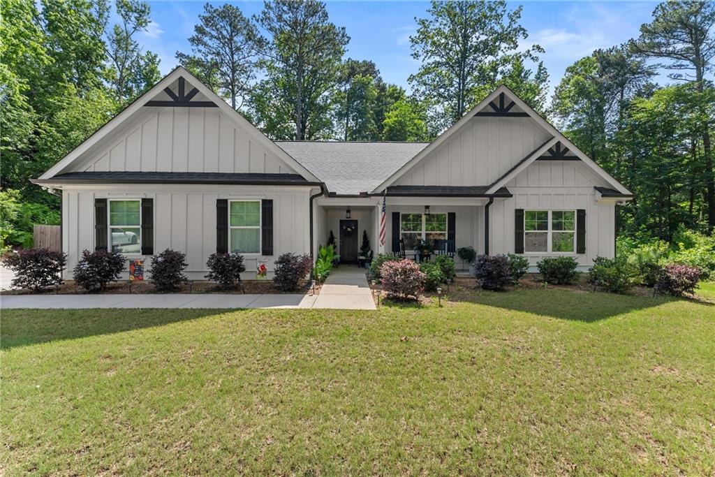 2751 Pilgrim Mill Road Cumming, GA 30041 - Photo 1 of 1 a view of a house with a yard and potted plants