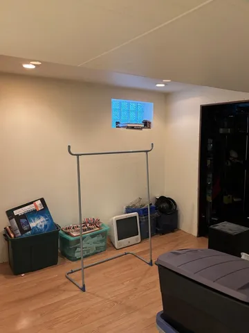 a living room with furniture and a lamp