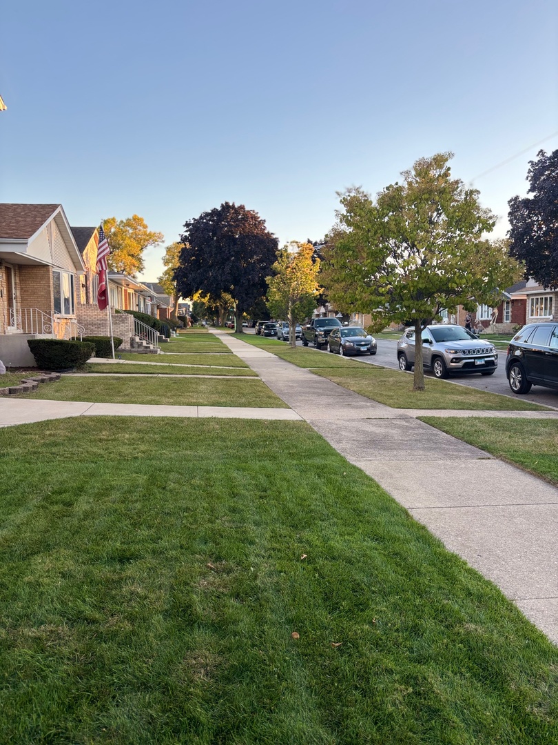 5137 South Rutherford Avenue Chicago, IL 60638 - Photo 4 of 23 a view of green field with house in the background