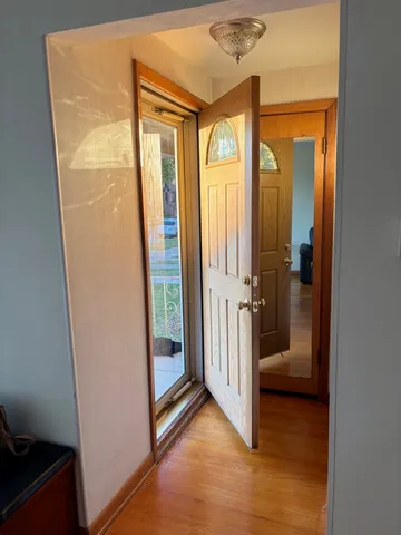 a view of a bathroom from a door