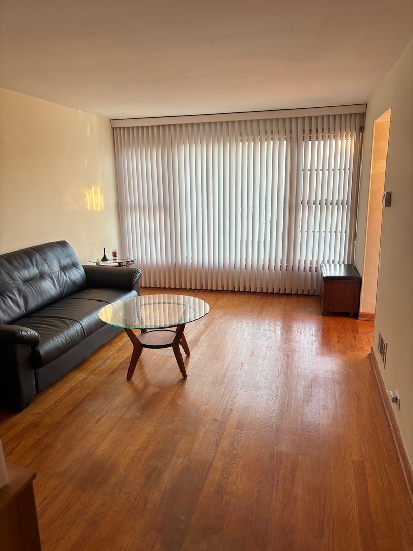 5137 South Rutherford Avenue Chicago, IL 60638 - Photo 7 of 23 a view of a livingroom with furniture and a couch