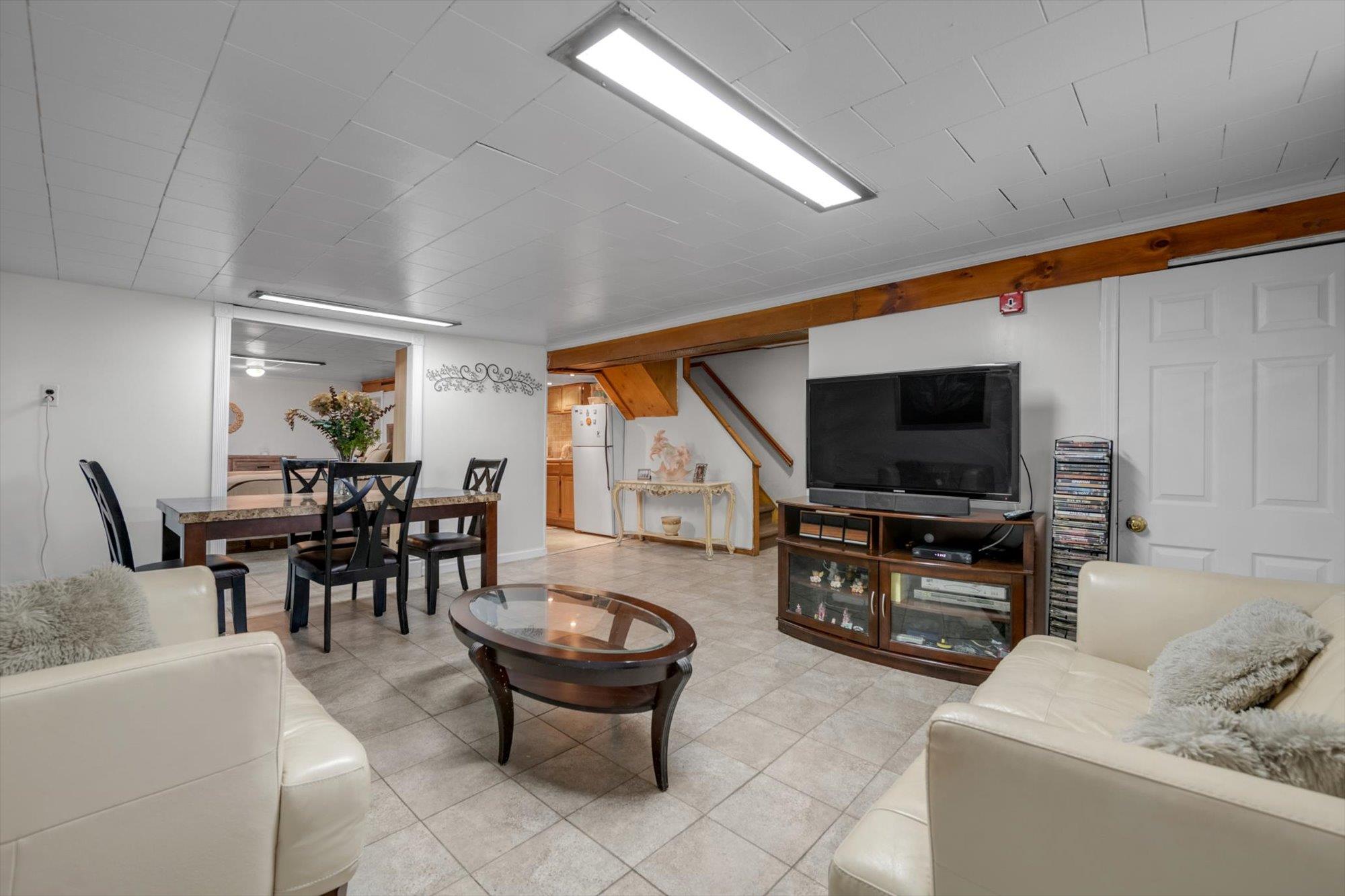 63-03 74th Street Queens, NY 11379 - Photo 11 of 15 Living room featuring light tile patterned flooring