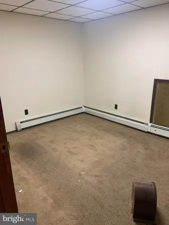 wooden floor and window in an empty room
