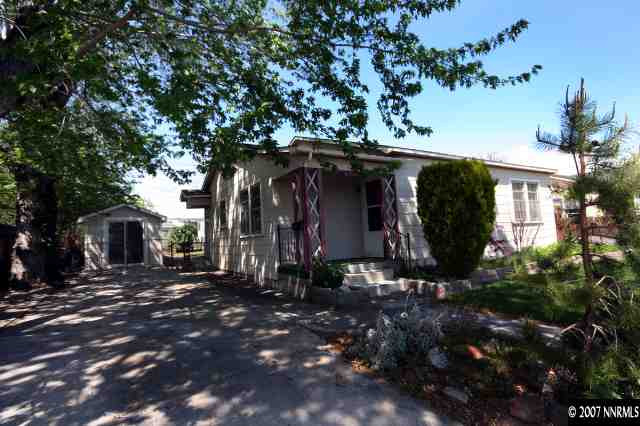 1663 Watt Street Reno, NV 89509 - Photo 5 of 7 a front view of a house with yard and trees
