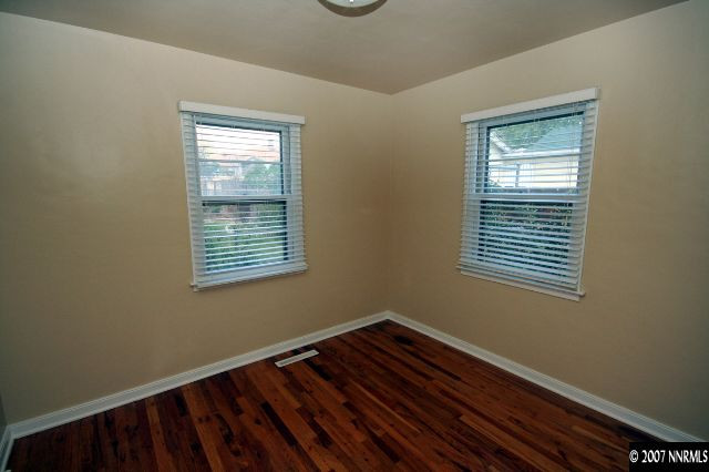 1663 Watt Street Reno, NV 89509 - Photo 6 of 7 a view of an empty room with wooden floor and a window