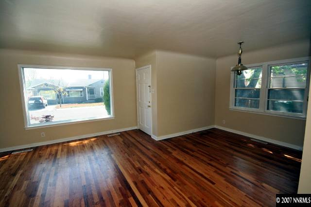1663 Watt Street Reno, NV 89509 - Photo 7 of 7 a view of an empty room with wooden floor and a window