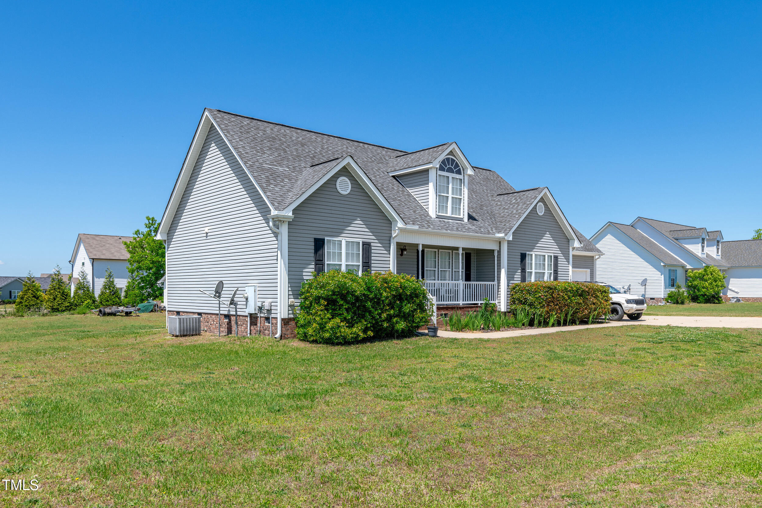 104 JJ Drive Benson, NC 27504 - Photo 2 of 20 a front view of a house with a yard