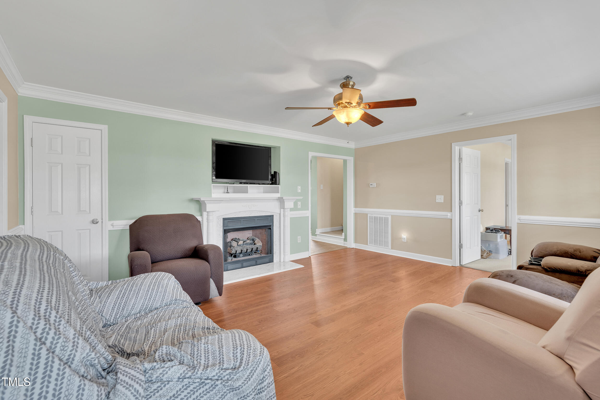 104 JJ Drive Benson, NC 27504 - Photo 4 of 20 a living room with furniture and a fireplace