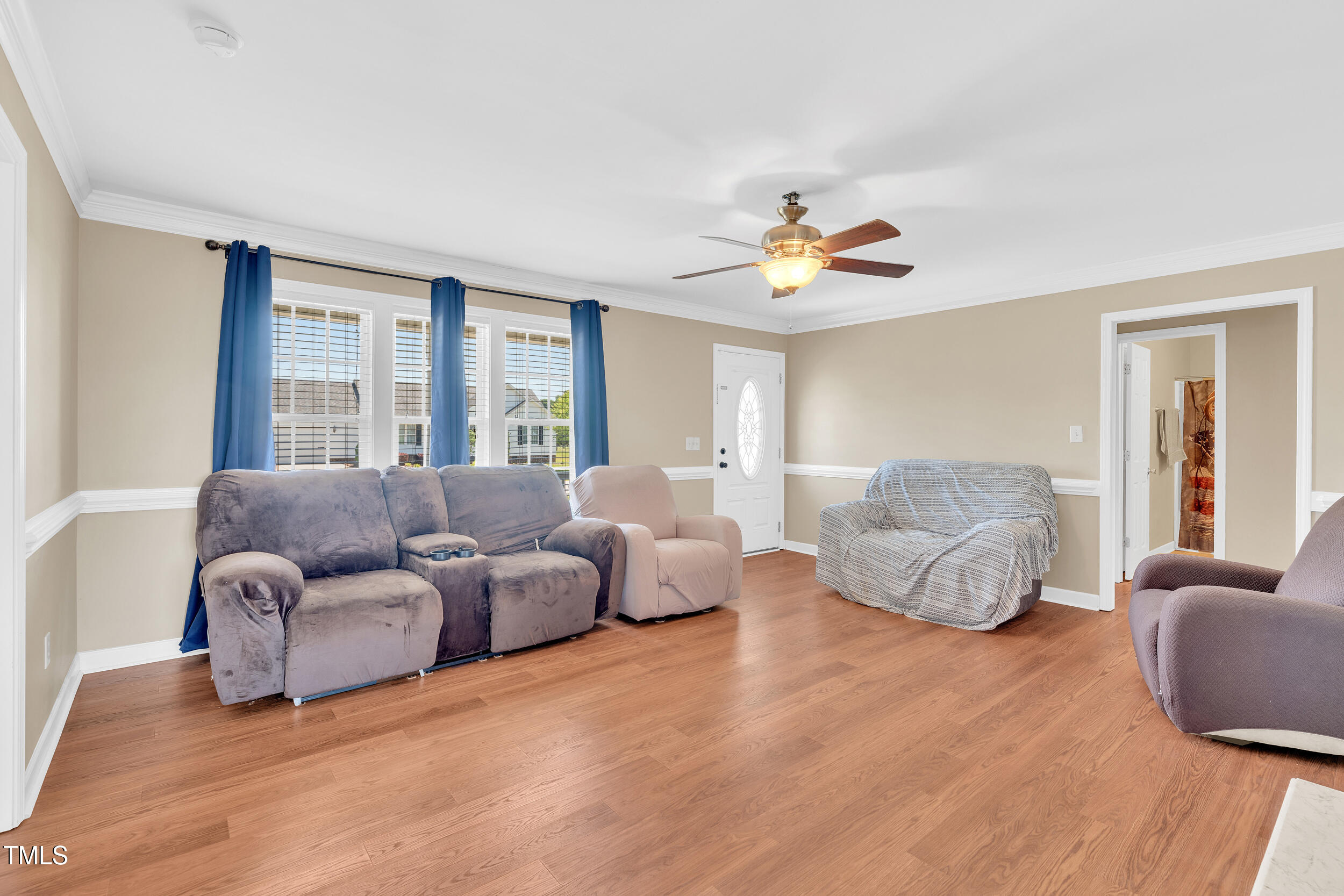 104 JJ Drive Benson, NC 27504 - Photo 5 of 20 a living room with furniture and a large window