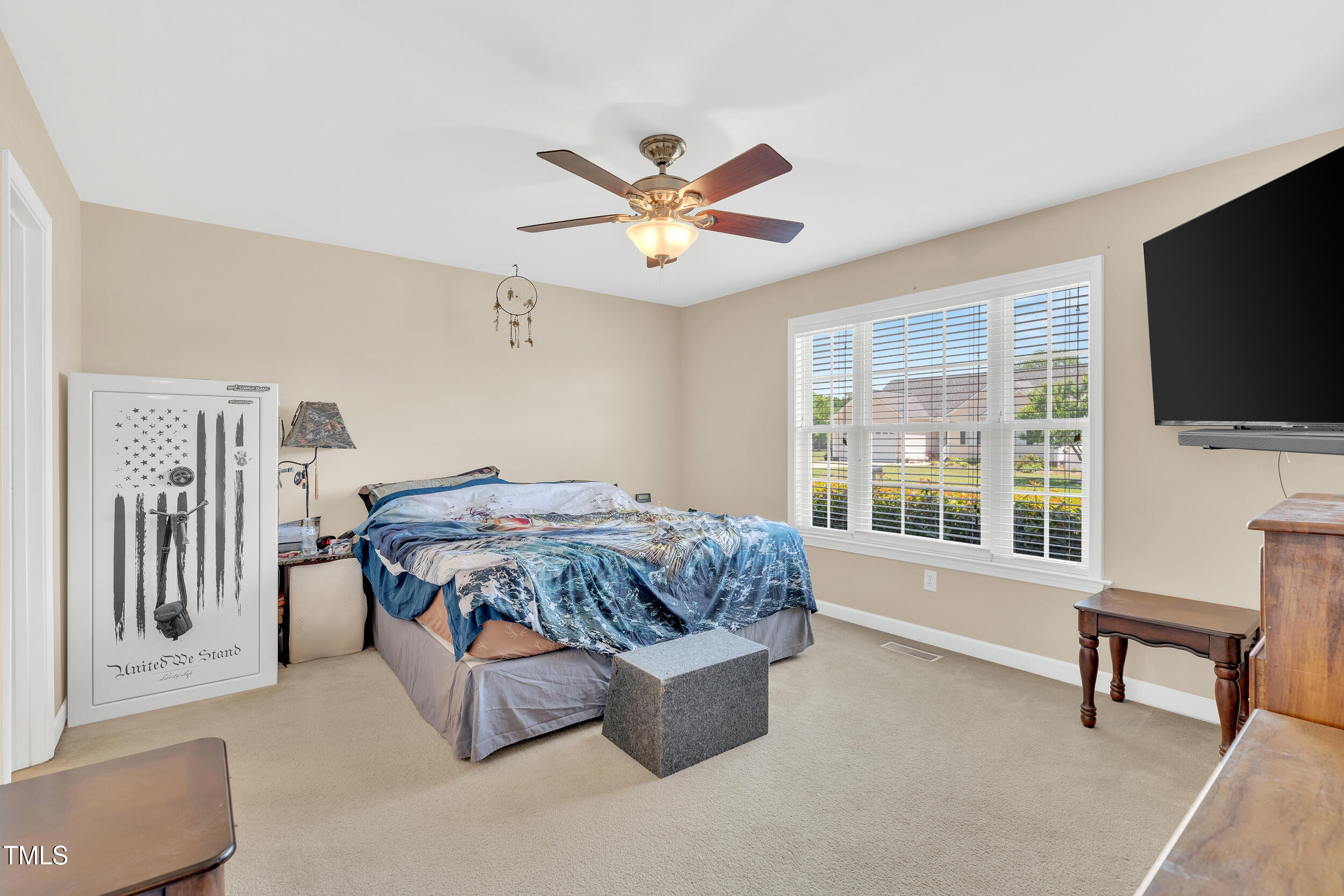 104 JJ Drive Benson, NC 27504 - Photo 8 of 20 a living room with furniture and a flat screen tv