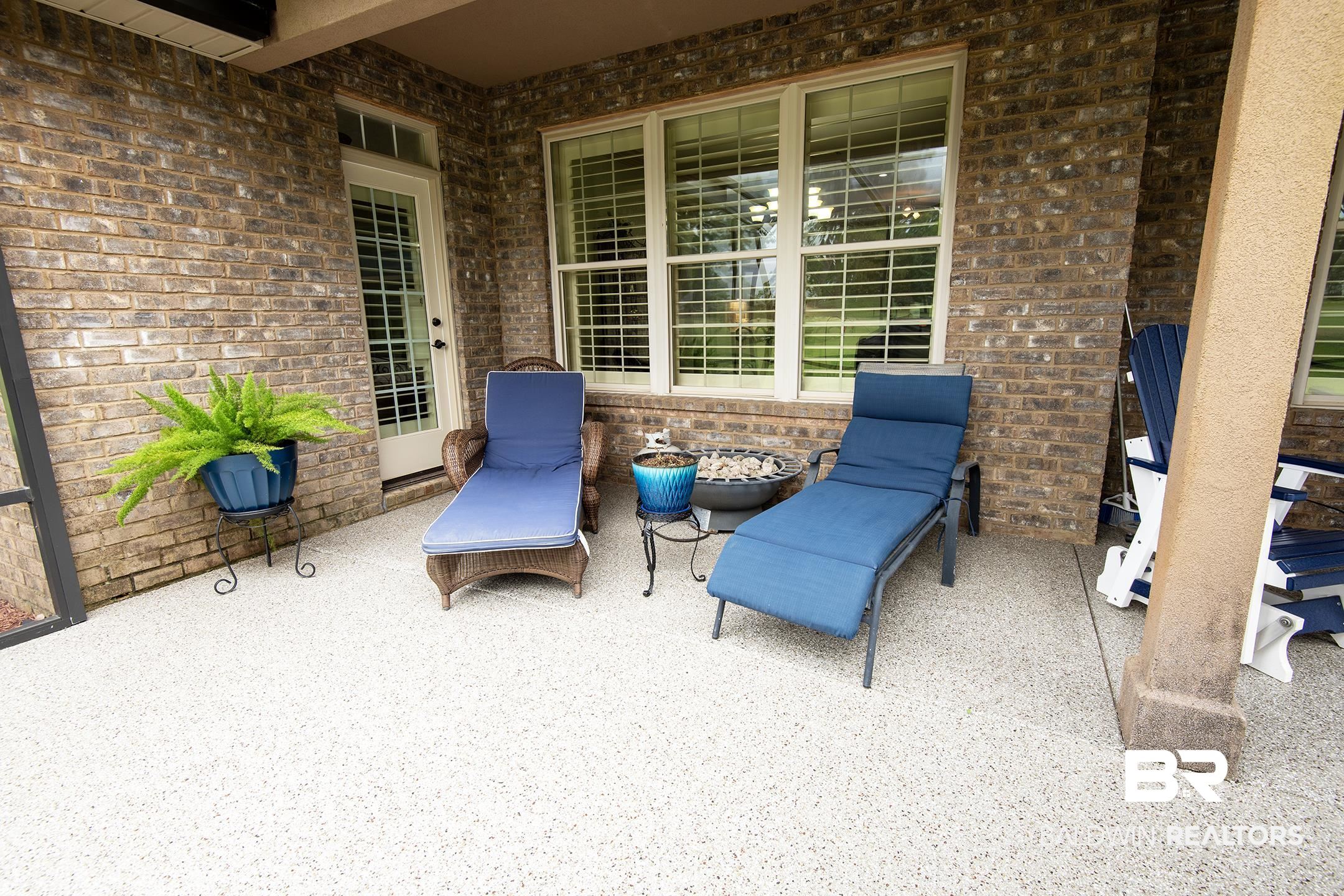 9357 Lakeview Drive Foley, AL 36535 - Photo 22 of 68 Covered patio featuring a speckled concrete finish