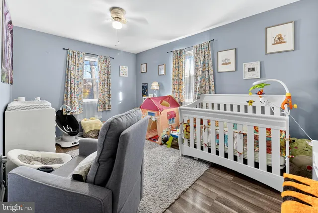 a bedroom with furniture and a window