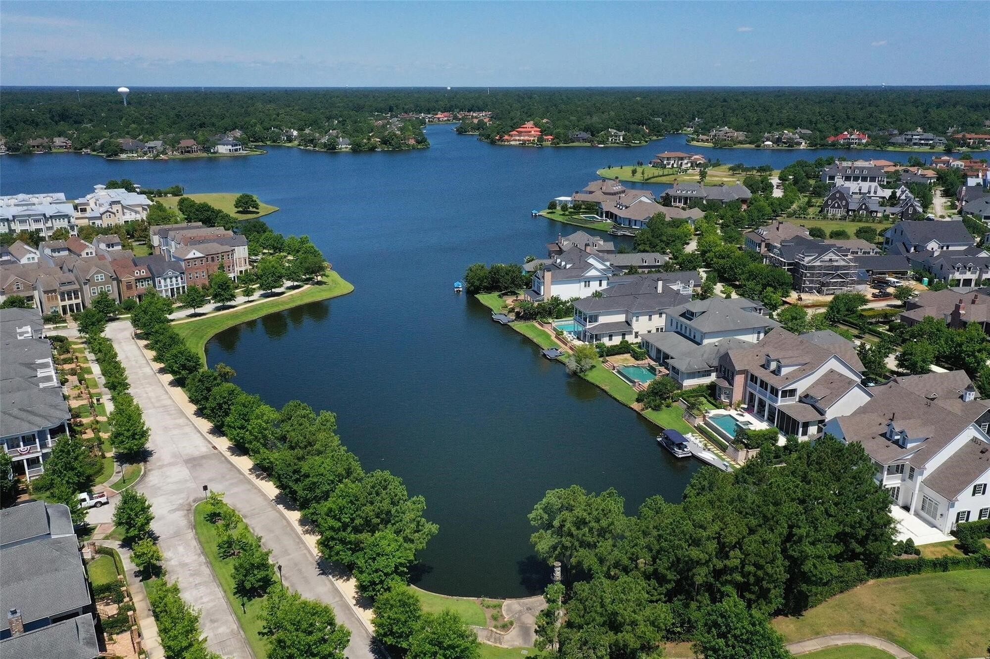 122 Gateway Park Place Spring, TX 77380 - Photo 42 of 44 Aerial views showcase East Shore’s lakefront enclave with manicured streets, waterfront homes, and scenic shoreline.