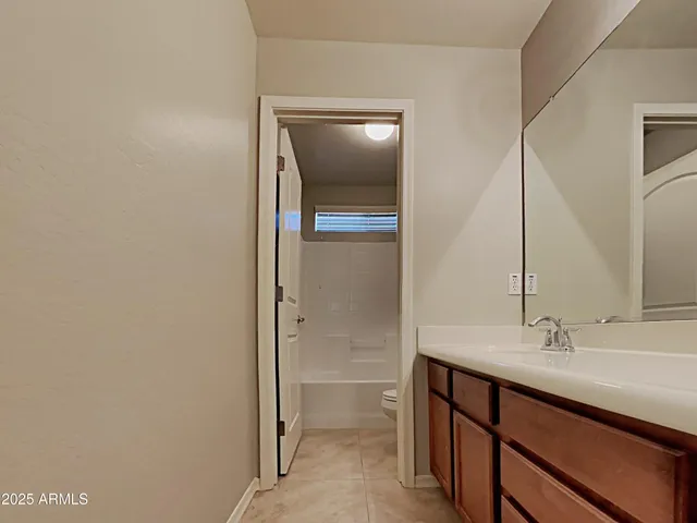 an empty room with a empty space and windows