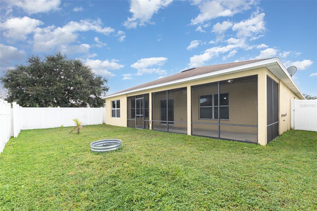 5100 Ballark Street Mount Dora, FL 32757 - Photo 27 of 28 a view of a backyard with table and chairs