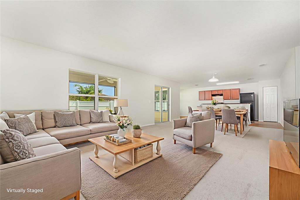 5100 Ballark Street Mount Dora, FL 32757 - Photo 3 of 28 a living room with furniture and a large window