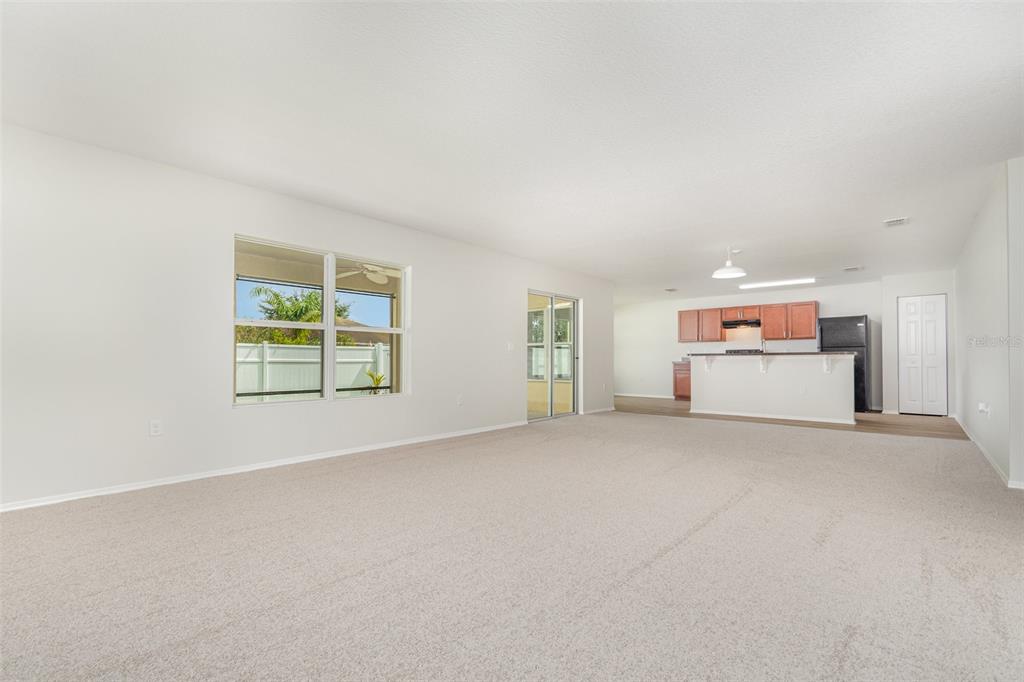 5100 Ballark Street Mount Dora, FL 32757 - Photo 4 of 28 an empty room with windows and closet