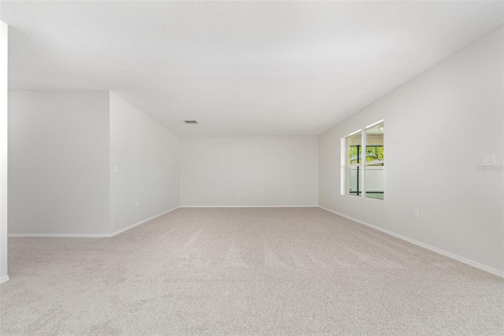 5100 Ballark Street Mount Dora, FL 32757 - Photo 6 of 28 an empty room with a window