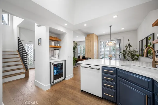 a kitchen with a sink stainless steel appliances and cabinets