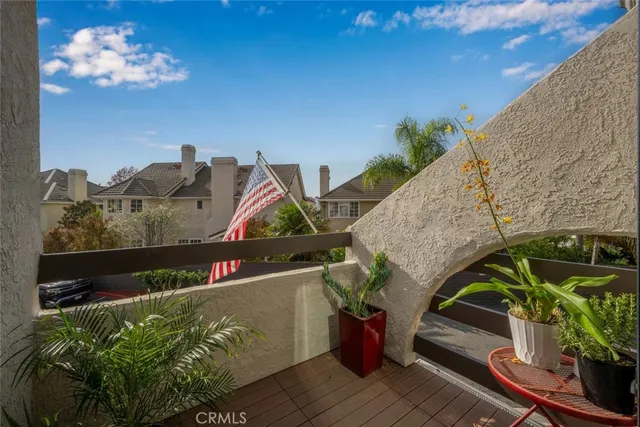 a view of hallway with stairs and wooden floor
