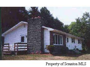 374 Rt Nicholson, PA 18441 - Photo 1 of 1 a backyard of a house with dishwasher and wooden fence