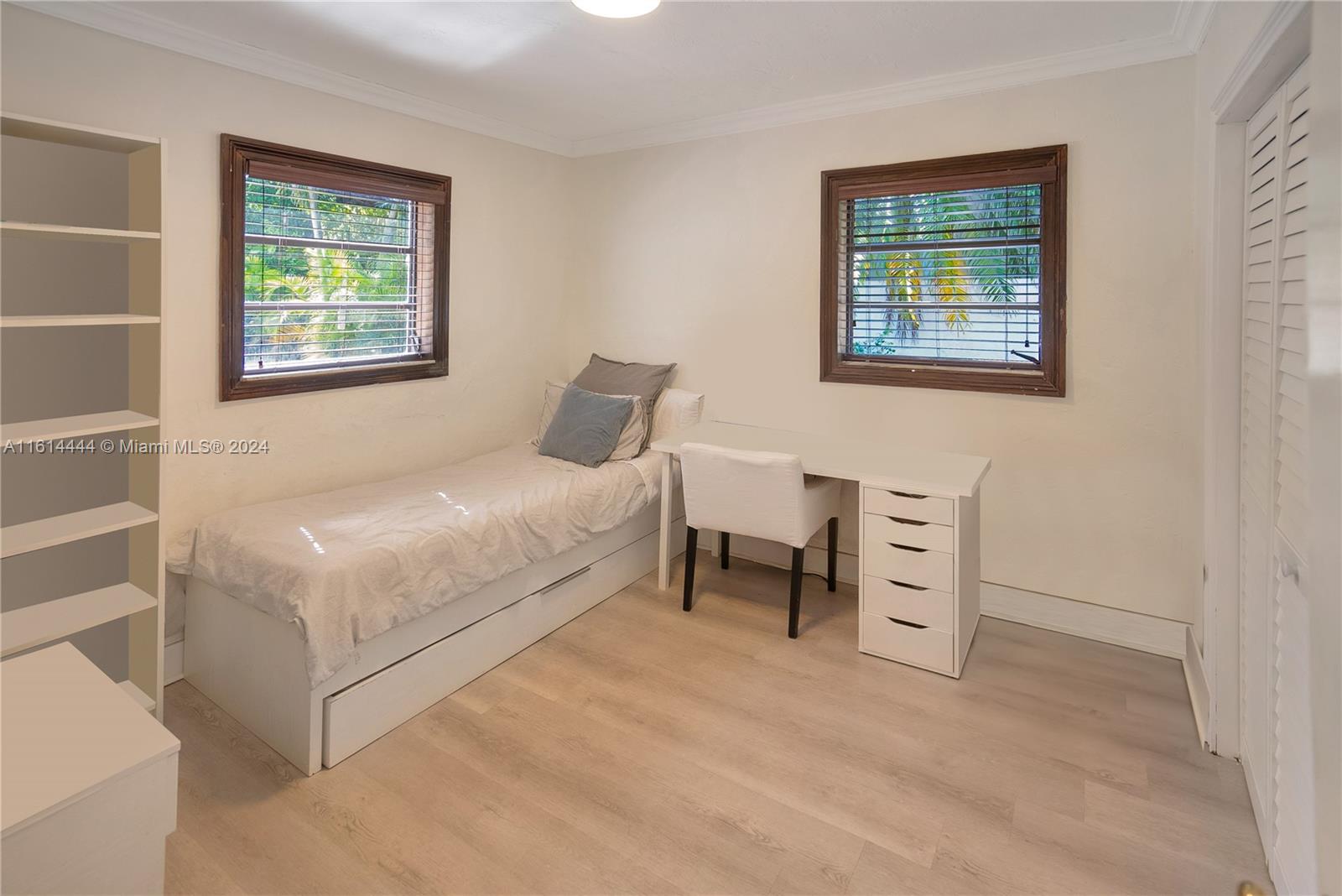 785 Fernwood Road Key Biscayne, FL 33149 - Photo 11 of 44 a bedroom with a bed and a window