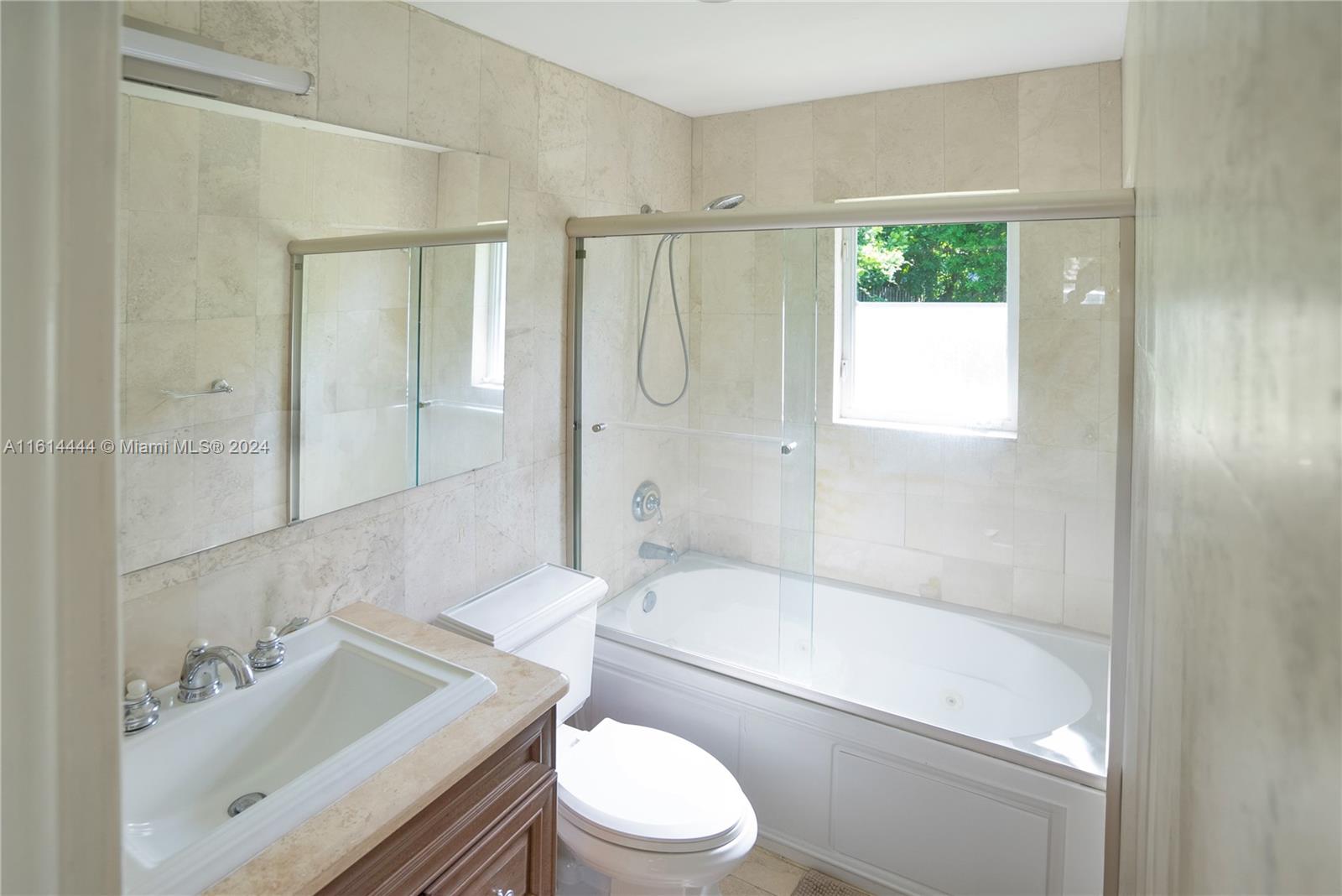 785 Fernwood Road Key Biscayne, FL 33149 - Photo 12 of 44 a bathroom with a sink toilet and shower