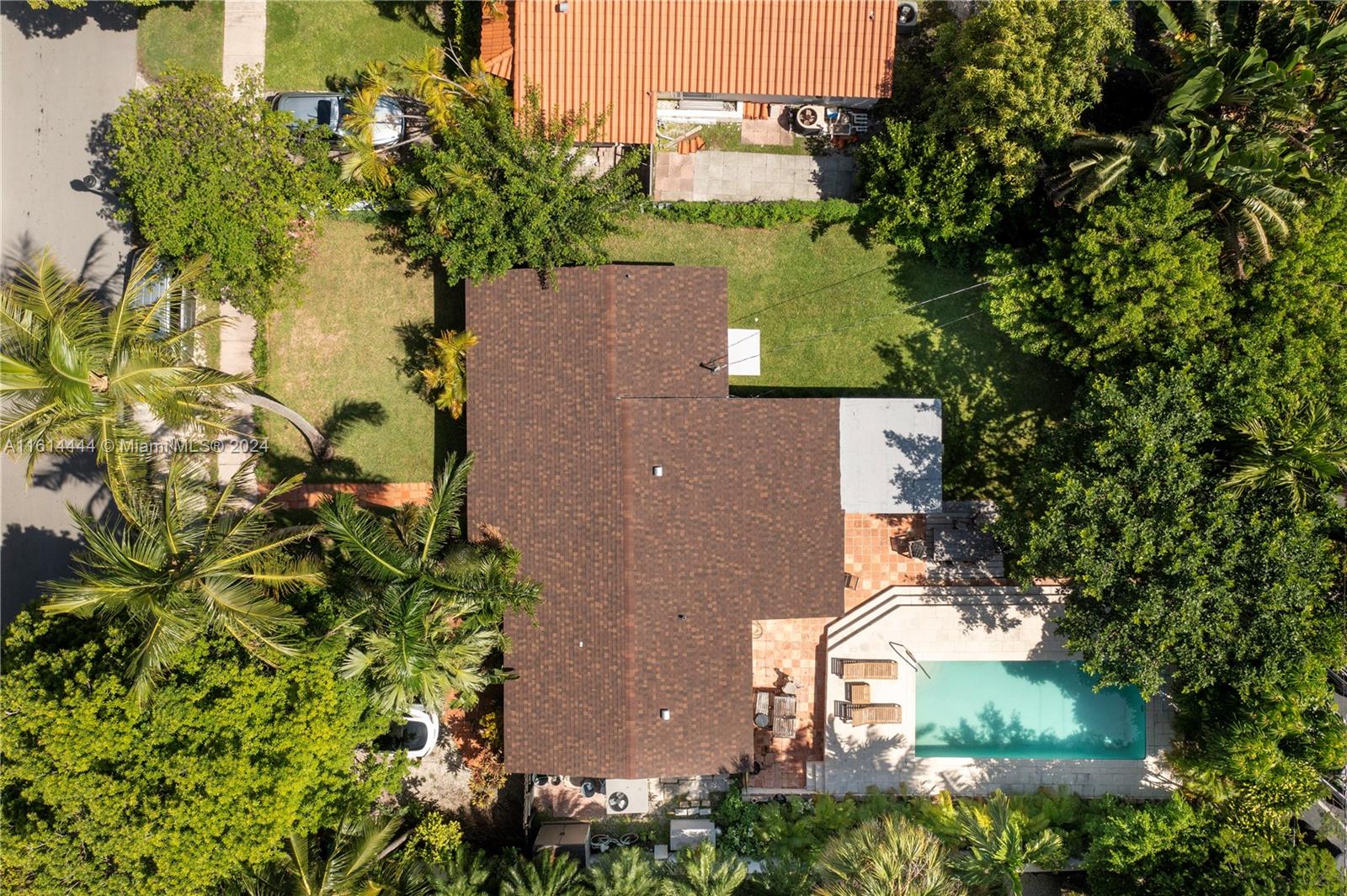 785 Fernwood Road Key Biscayne, FL 33149 - Photo 13 of 44 an aerial view of a house with a yard
