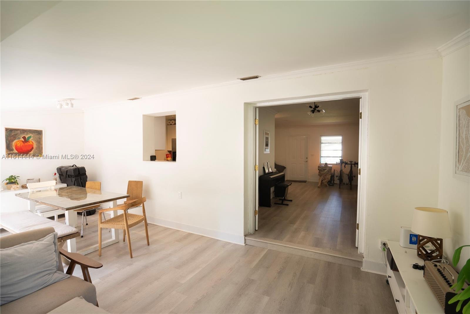 785 Fernwood Road Key Biscayne, FL 33149 - Photo 6 of 44 a view of a workspace with furniture and a livingroom
