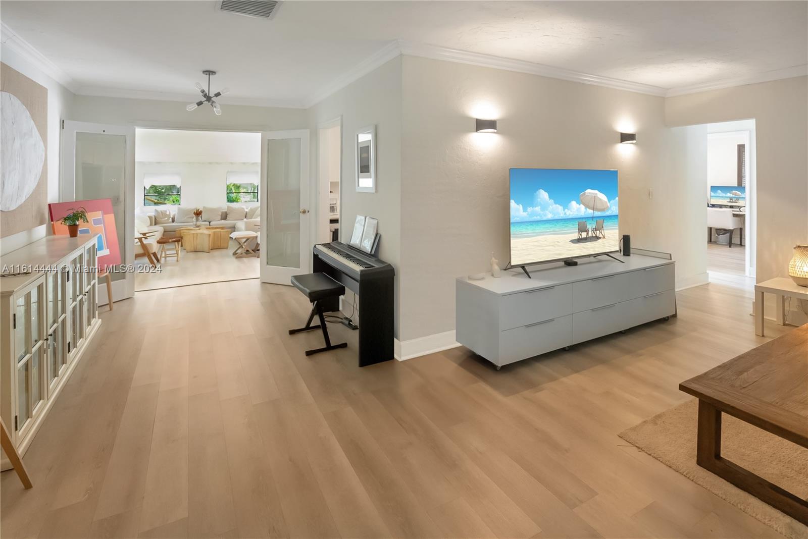 785 Fernwood Road Key Biscayne, FL 33149 - Photo 7 of 44 a living room with furniture and a flat screen tv