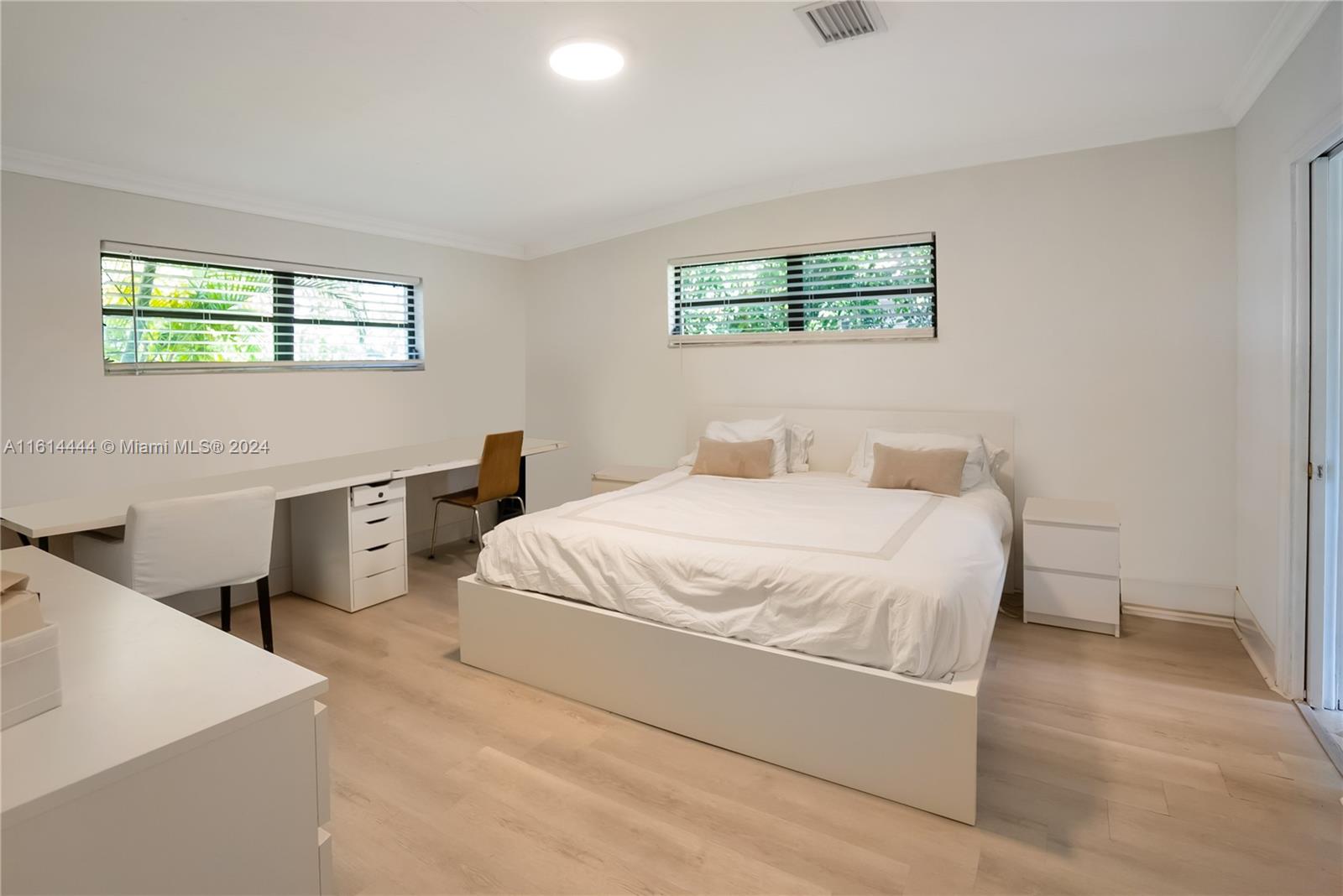 785 Fernwood Road Key Biscayne, FL 33149 - Photo 9 of 44 a bedroom with a bed and a window