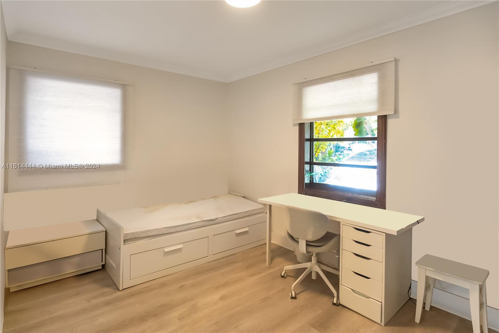 785 Fernwood Road Key Biscayne, FL 33149 - Photo 10 of 44 a view of a workspace with furniture and a window