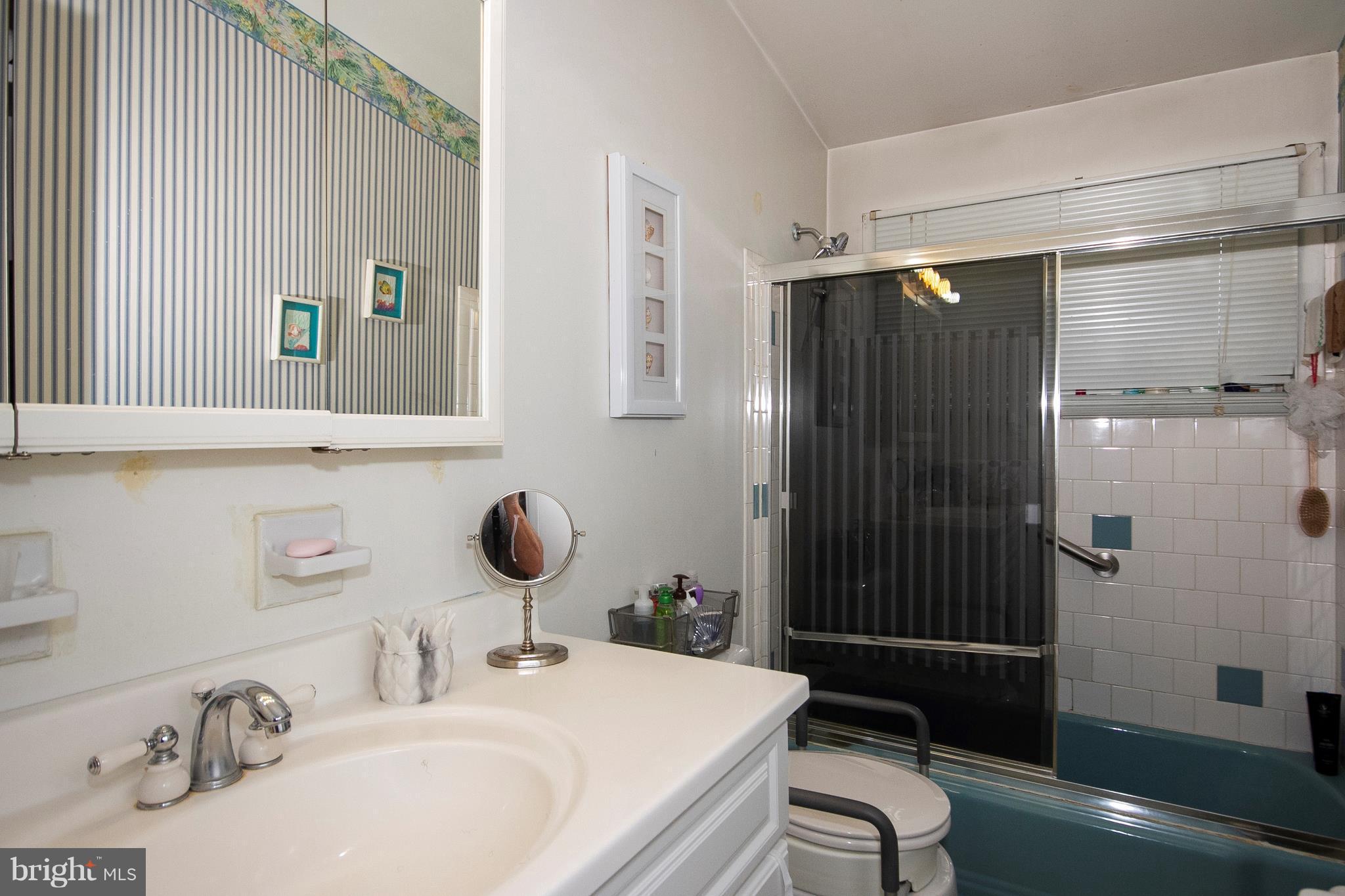 3409 Retlaw Road Baltimore, MD 21207 - Photo 14 of 25 a bathroom with a sink toilet and shower