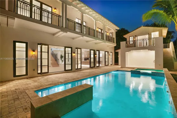 a view of a swimming pool with a yard