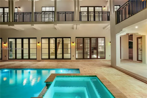 a front view of a house with swimming pool