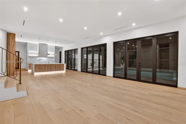 a view of an empty room with a fireplace