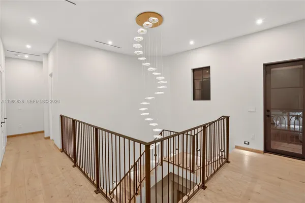 a view of a hallway with a chandelier
