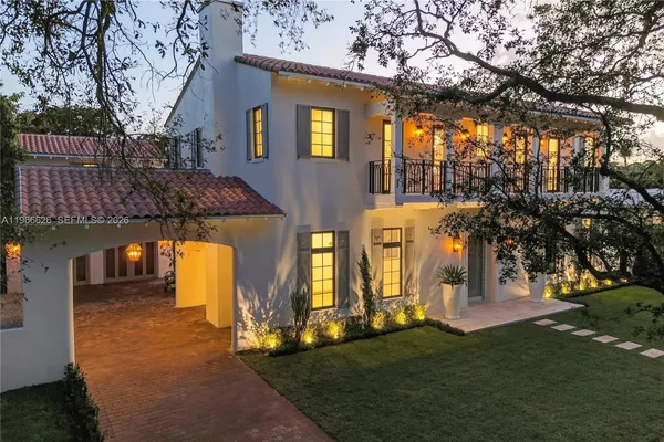 a aerial view of a house with a yard