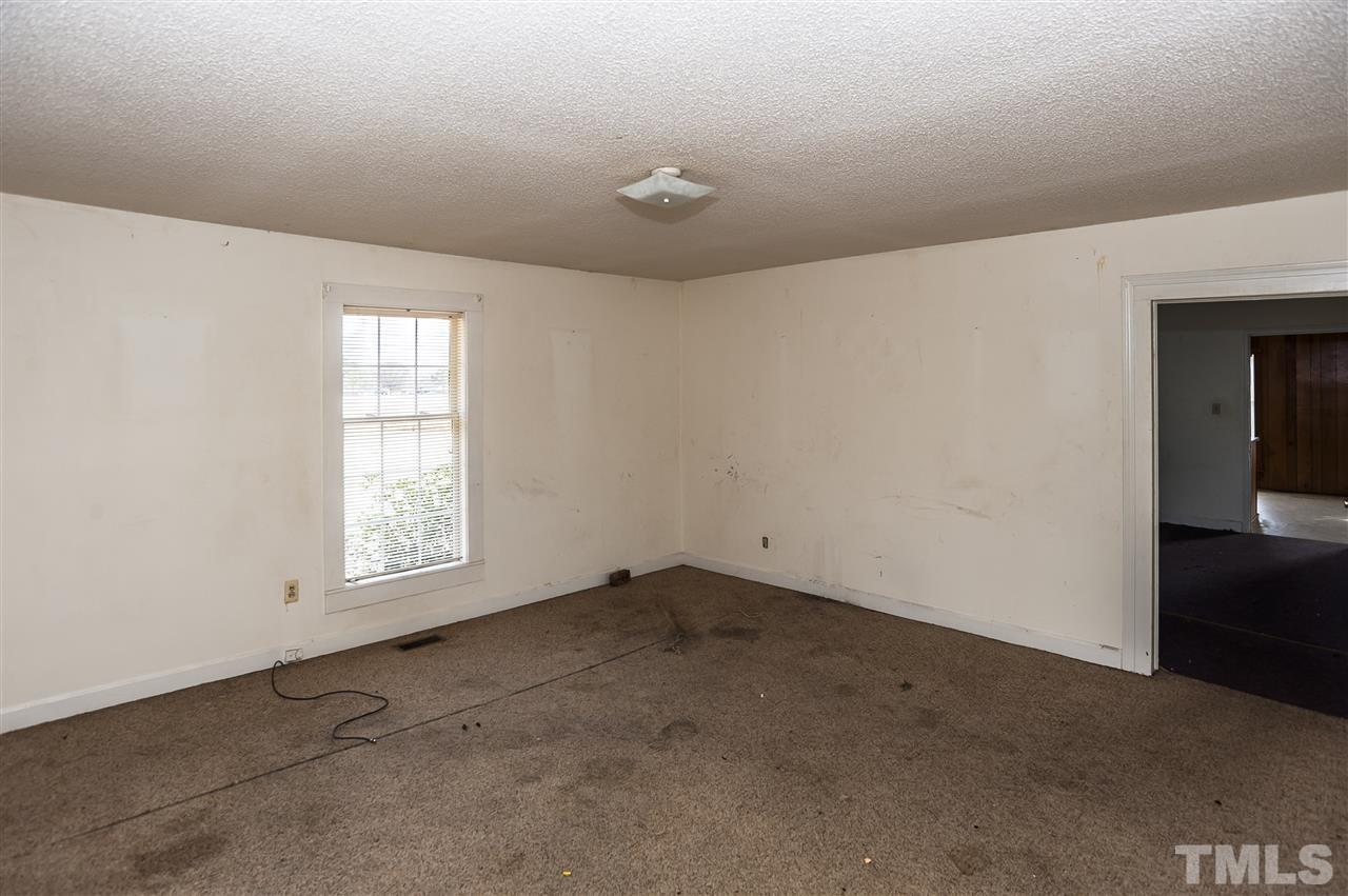199 West Strickland Road Dunn, NC 28334 - Photo 14 of 25 an empty room with windows