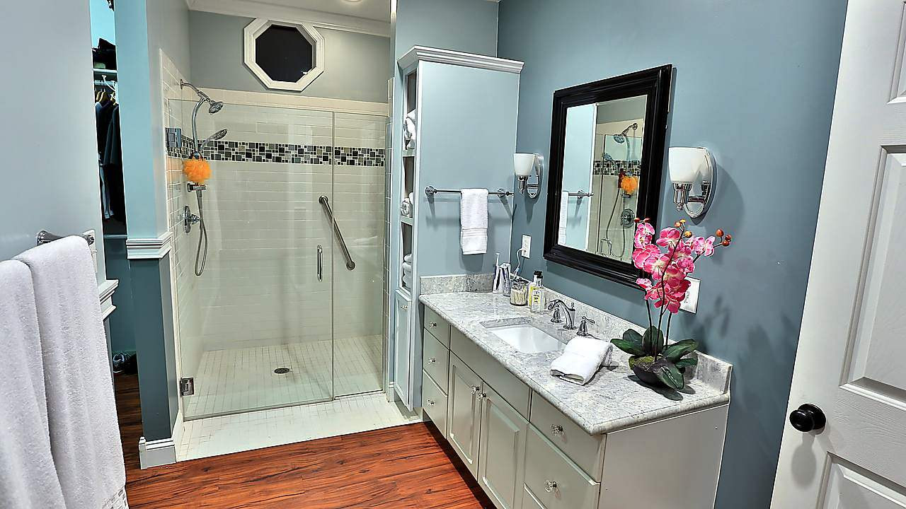 8536 Yucca Trail Raleigh, NC 27615 - Photo 6 of 23 Remodeled master bath has beautiful marble countertop and easy-access shower. This room opens to the walk-in closet. Master bath